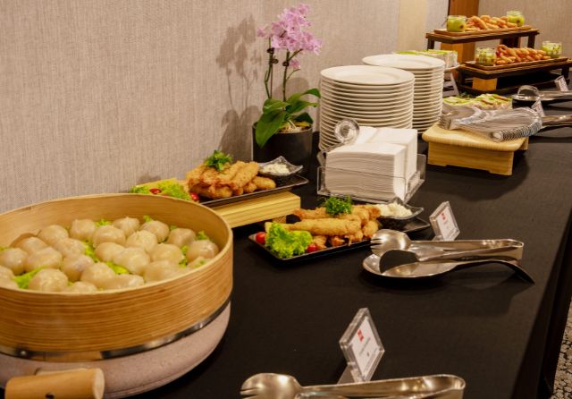 Corporate meeting coffee break setup featuring dim sum, fried appetisers, sandwiches and refreshments at ibis Singapore on Bencoolen