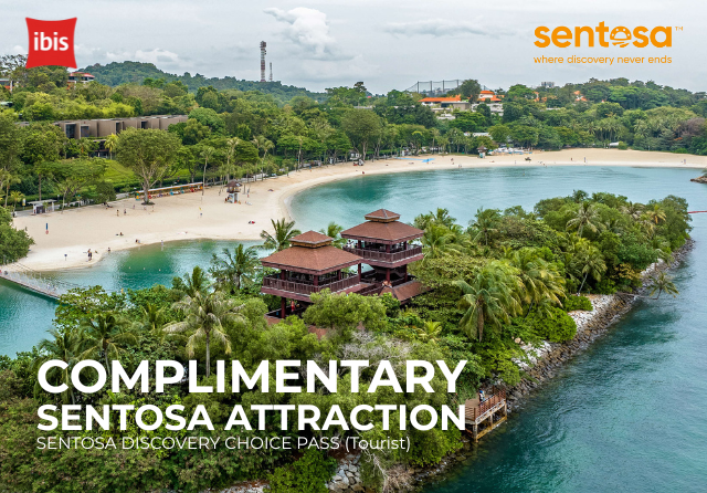 A scenic view of Sentosa’s sandy beach and lush greenery with promotional text: “Complimentary Sentosa Attraction – Sentosa Discovery Choice Pass (Tourist),” co-branded by ibis and Sentosa.