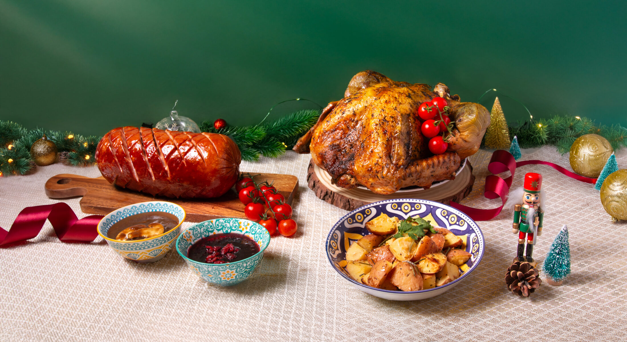Whole roasted turkey and glazed ham with festive sides and décor, part of the Christmas Feast 2025 from TASTE Restaurant Singapore.