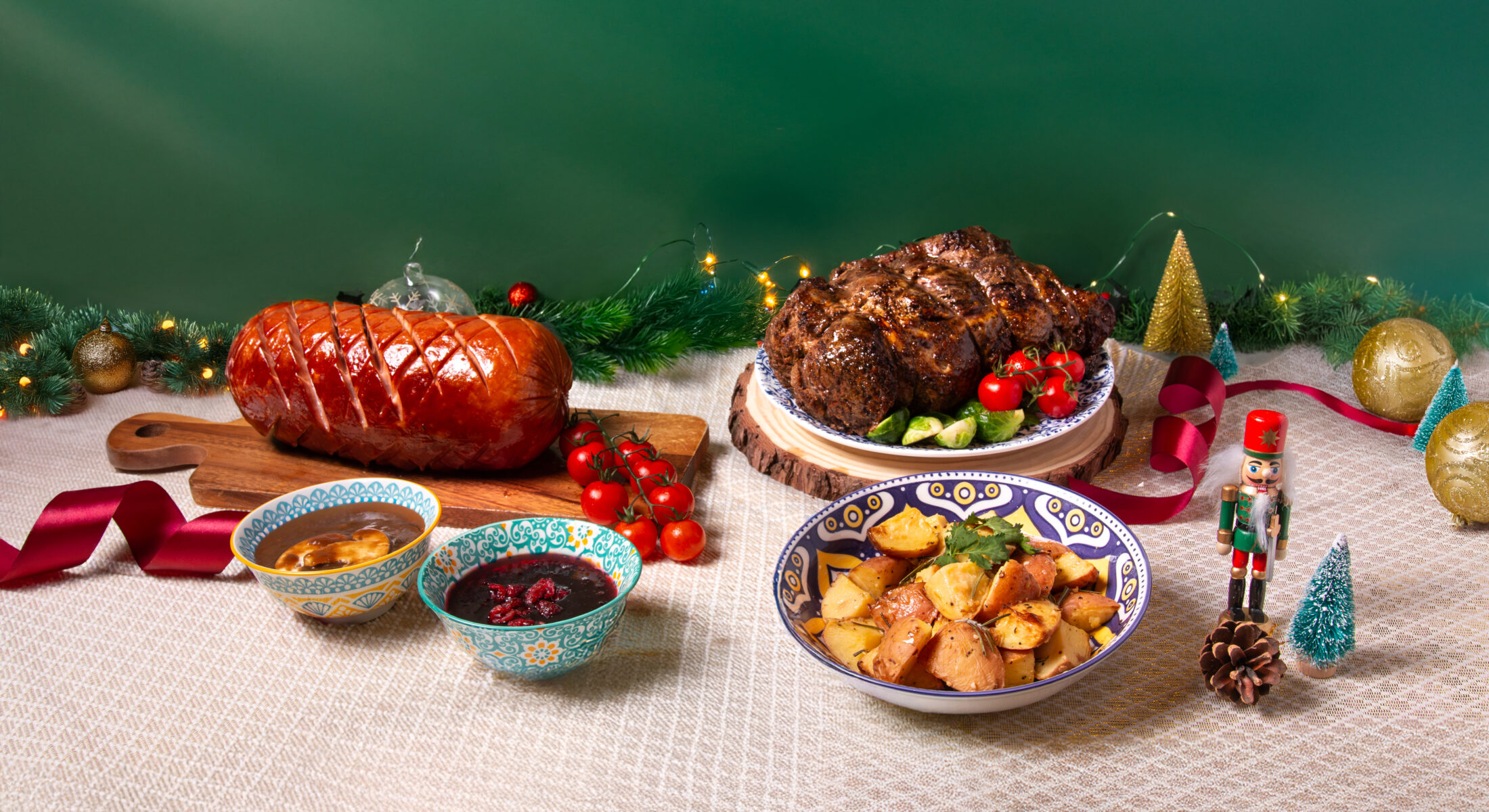 Christmas platter of Bulgogi ribeye roast and glazed ham with seasonal décor from TASTE Restaurant, ibis Singapore on Bencoolen.