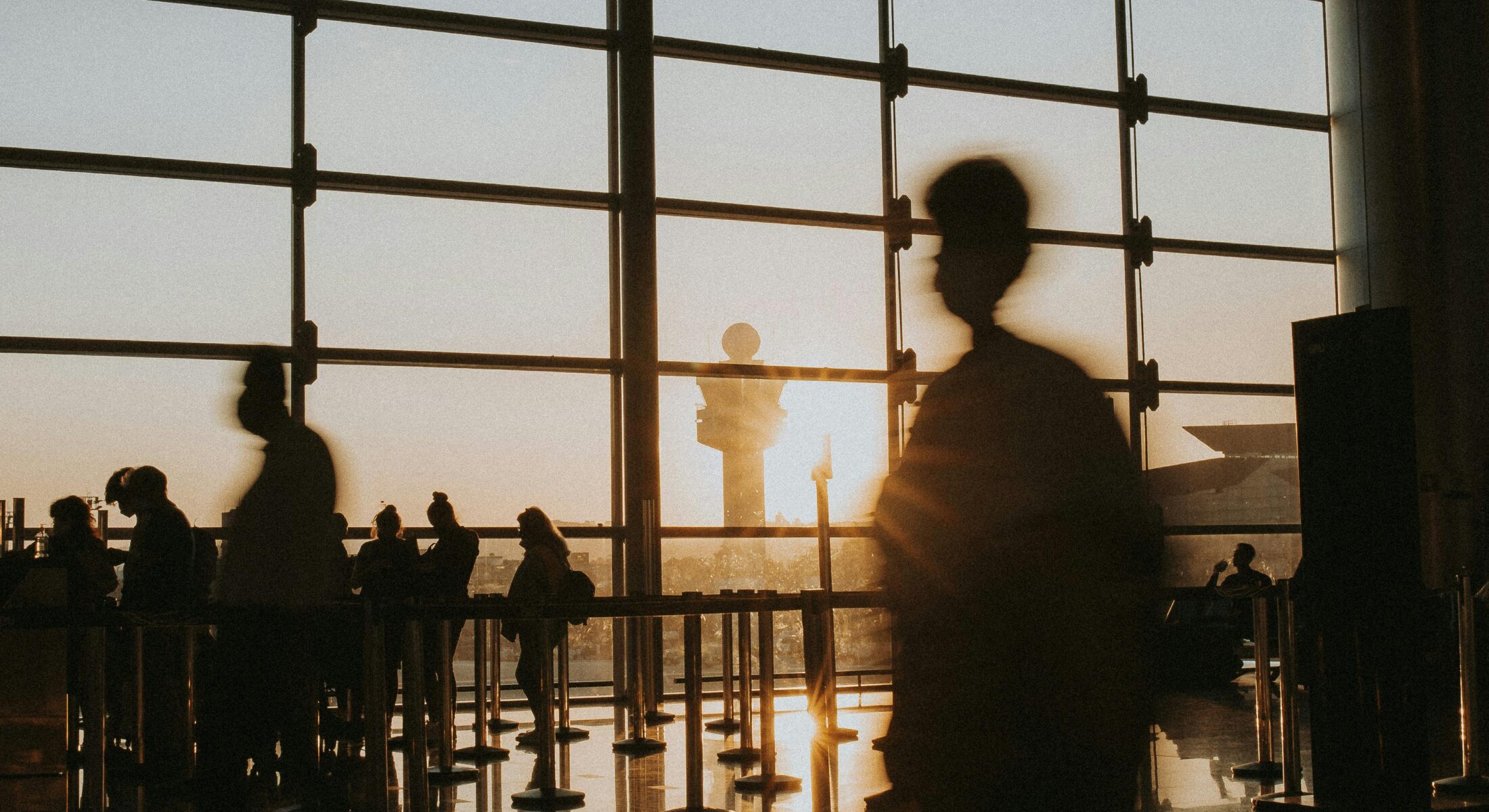 Business travellers walking through an airport terminal in Singapore en route to Business Travel Show Asia Pacific 2026