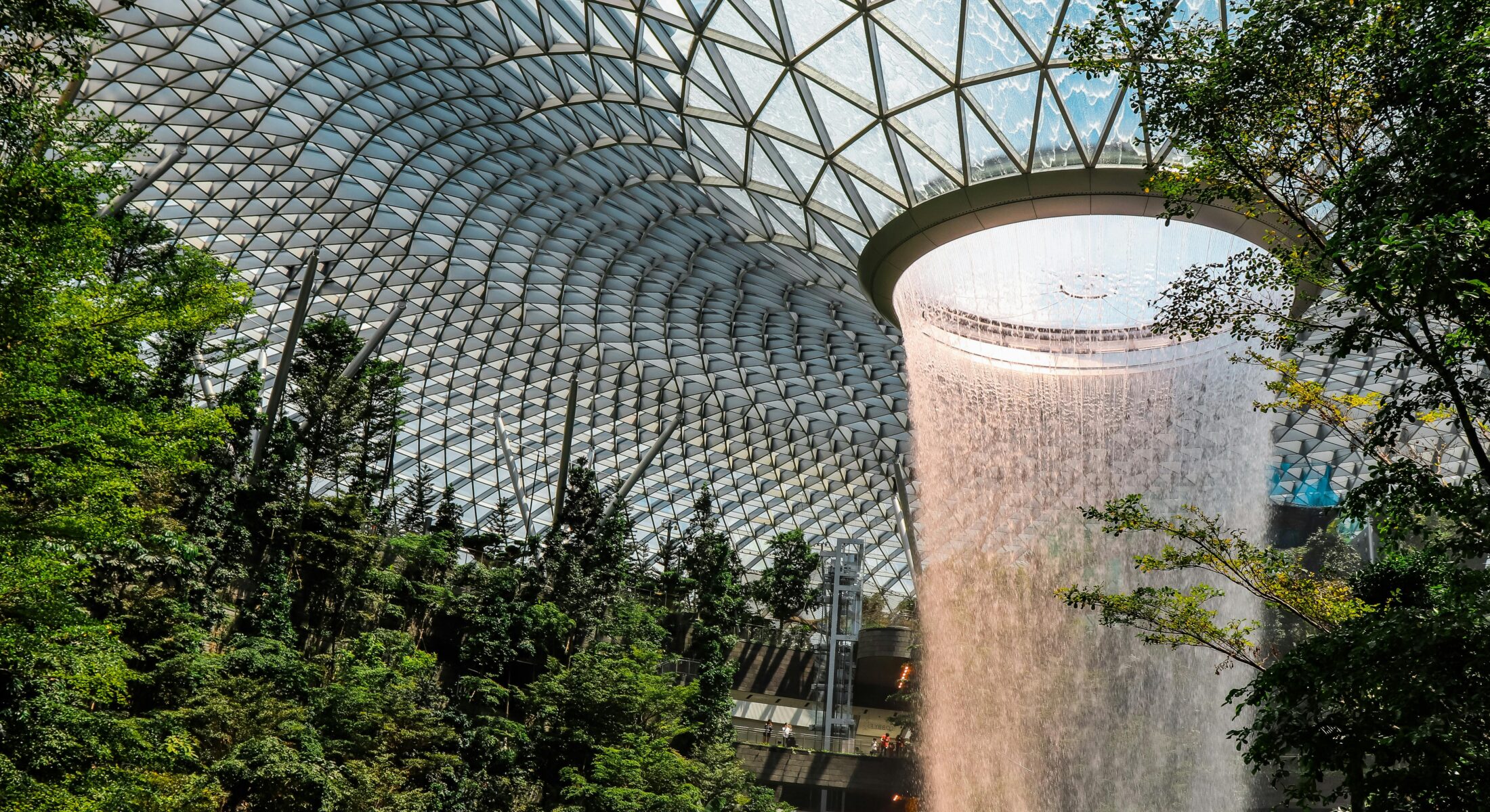 Jewel Changi Airport’s indoor waterfall and glass dome, a landmark destination for international event delegates in Singapore.