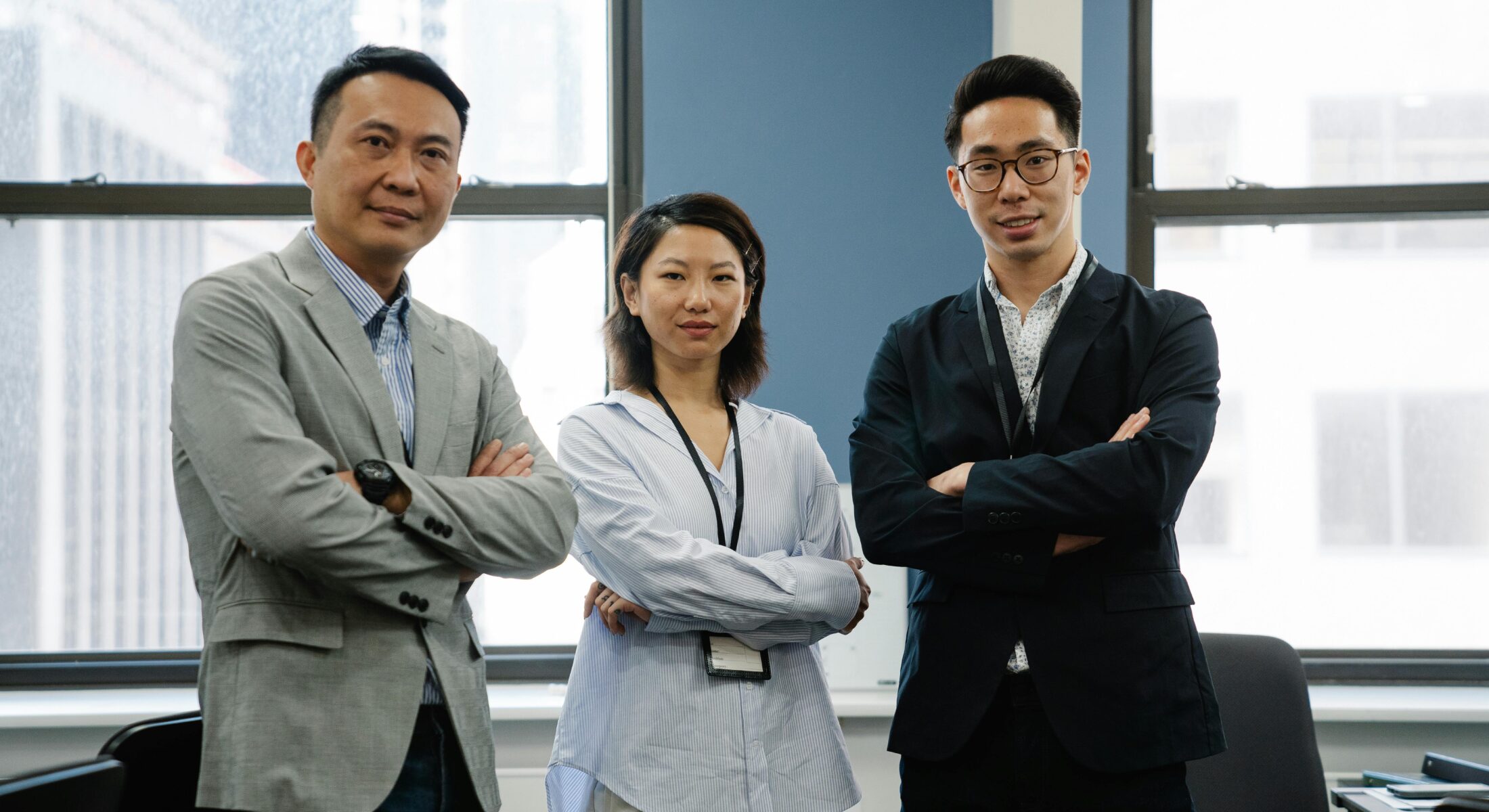 Corporate group delegates standing confidently at ibis Singapore on Bencoolen, ideal for business meetings, conferences and group stays in Singapore.